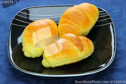 Image of Close-up  bread loaf stacked on a black plate