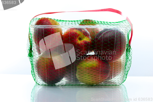 Image of peaches packed in a plastic container