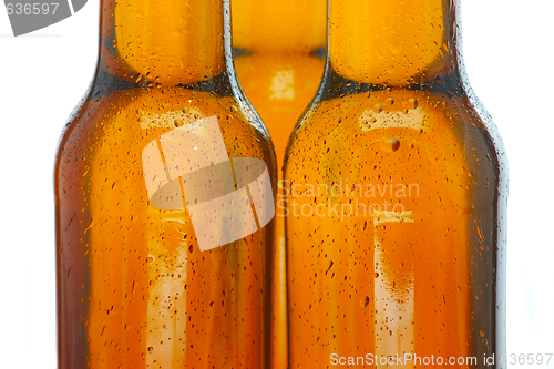 Image of Upper part of three beer bottles