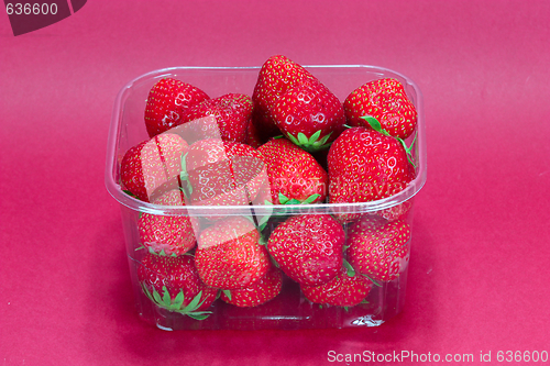 Image of strawberry in plastic packaging