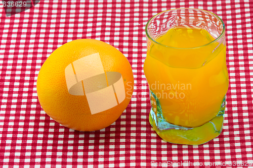 Image of glass of orange juice and fruit