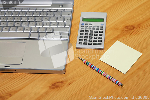 Image of Calculator and notebook