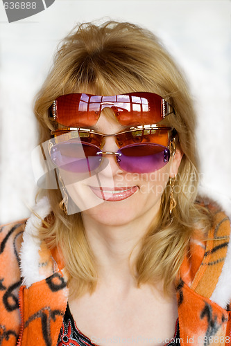 Image of The woman in sunglasses