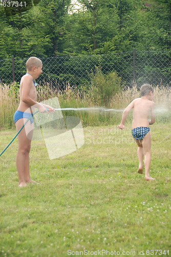 Image of boys play on the grass