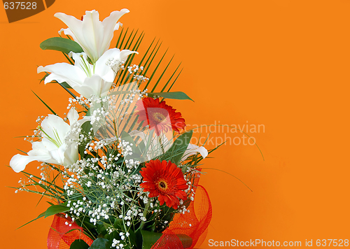 Image of flower bouquet over orange