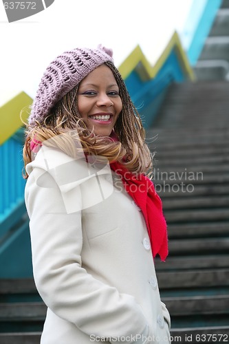 Image of african girl in white coat