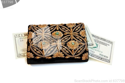 Image of Embroidered woman purse and dollar banknotes isolated