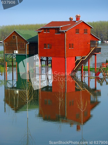 Image of Red houses and flooding river