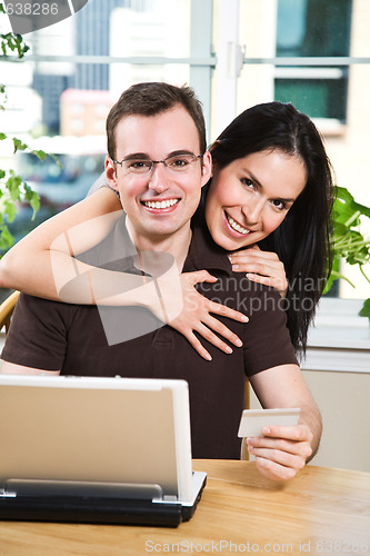 Image of Happy couple shopping online