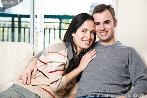 Image of Happy couple relaxing at home