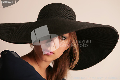 Image of attractive young woman in hat
