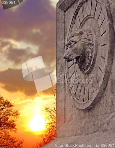 Image of Stone lion at sunset