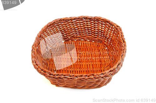 Image of Empty orange wicker basket isolated 