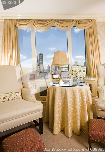 Image of sitting area in city apartment with skyline views