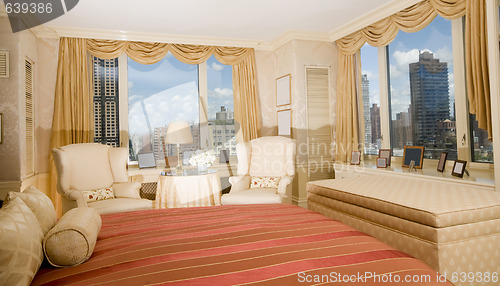 Image of master bedroom with sitting area in penthouse new york