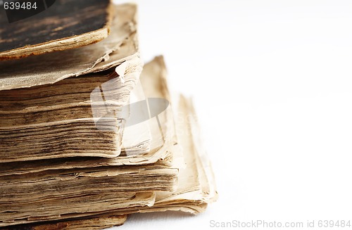 Image of Old book with hard leather cover on white.