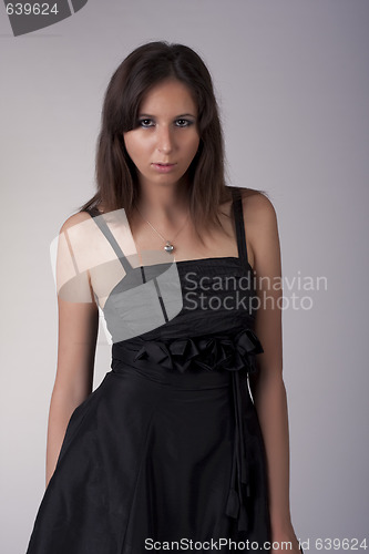 Image of Beautiful young model in black dress