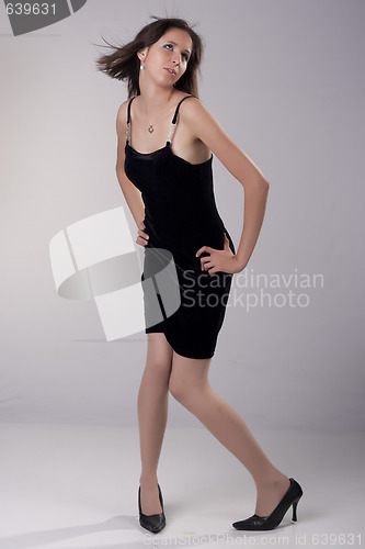 Image of Sexy you women in short black dress