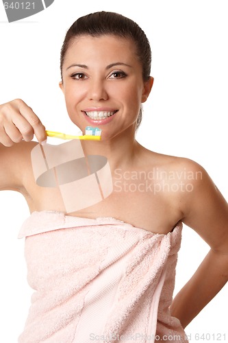 Image of Smiling woman holding a toothbrush