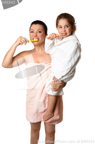 Image of Mother and daughter brushing their teeth