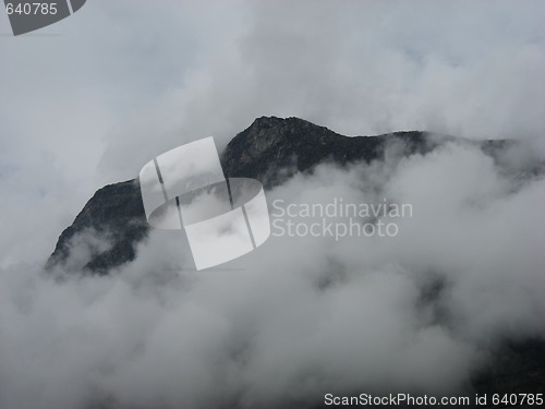 Image of Mountain top through the clouds
