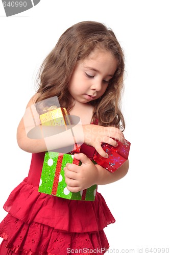 Image of Girl holding an armful of Christmas presents