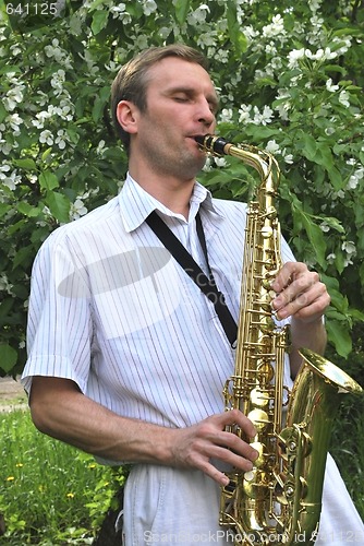 Image of  man with saxophone