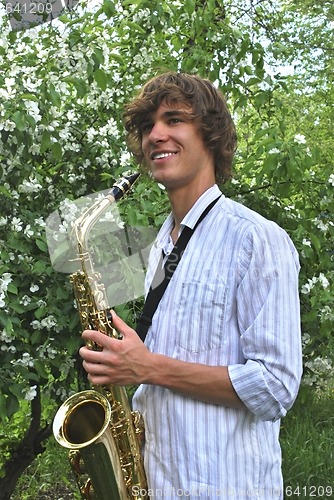 Image of young man with saxophone