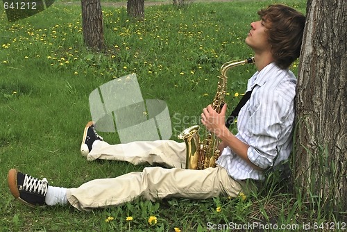 Image of young man with saxophone
