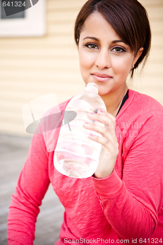 Image of Sporty woman drinking