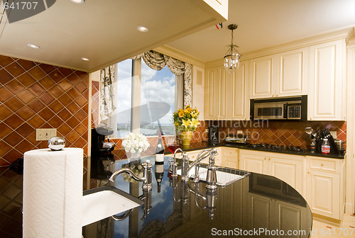 Image of kitchen in city apartment with skyline views