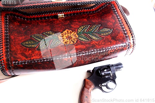 Image of Leather purse and pistol