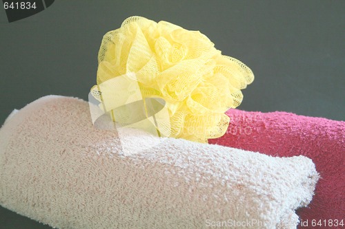 Image of Two towels and sponge for the spa