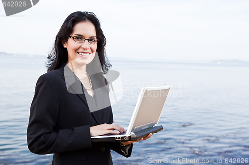 Image of Hispanic businesswoman with laptop