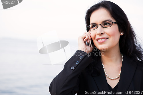 Image of Hispanic businesswoman on the phone