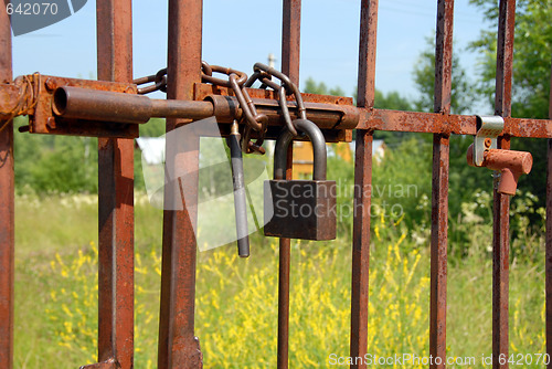 Image of Locked rusty gate