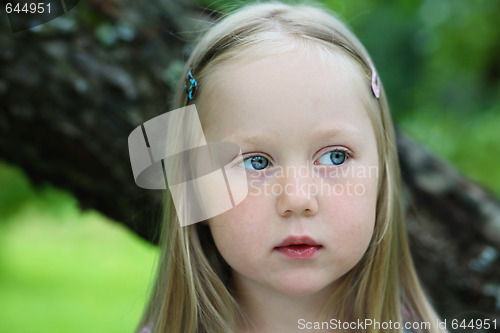 Image of Portrait of thoughtful little girl.