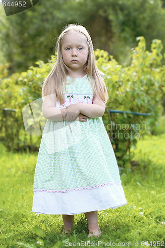 Image of Portrait of thoughtful little girl.