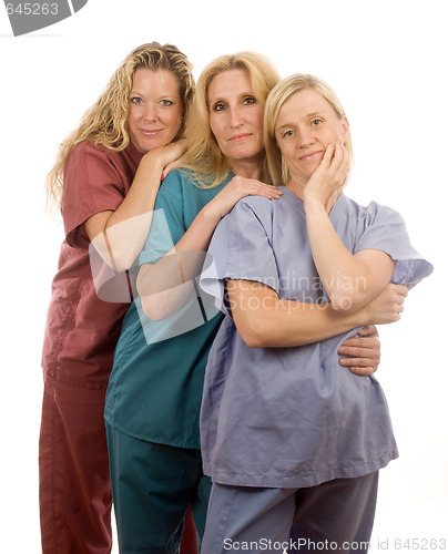 Image of three nurses in medical scrubs clothes