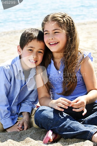 Image of Brother and sister at beach