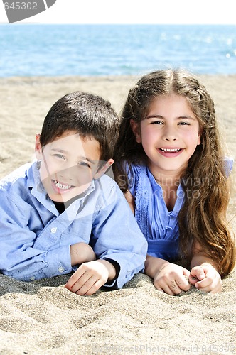Image of Brother and sister at beach
