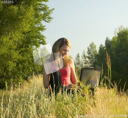 Image of woman with notebook
