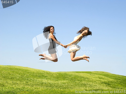 Image of two jumping woman