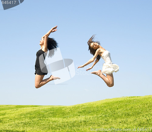 Image of two jumping woman