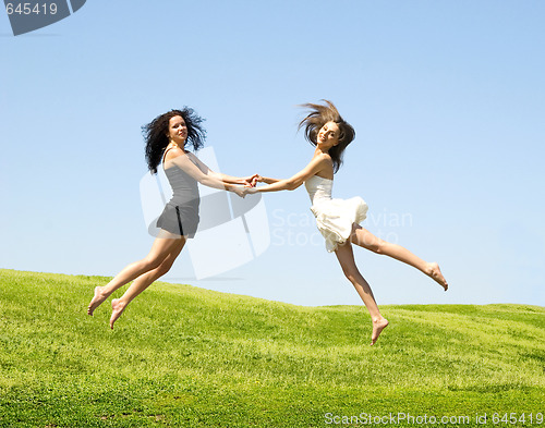 Image of two jumping woman