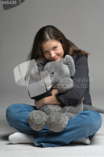 Image of young woman with big toy mouse