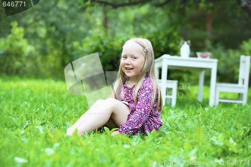 Image of Smiling little girl outdoors.