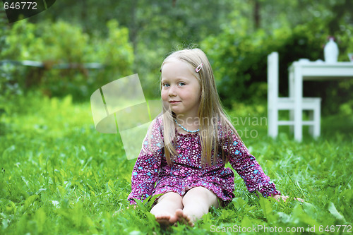 Image of Smiling little girl outdoors.
