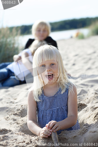 Image of Young girl having fun at beach.