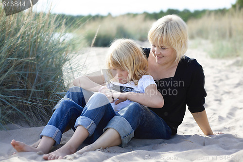 Image of Mother and daughter at beach.